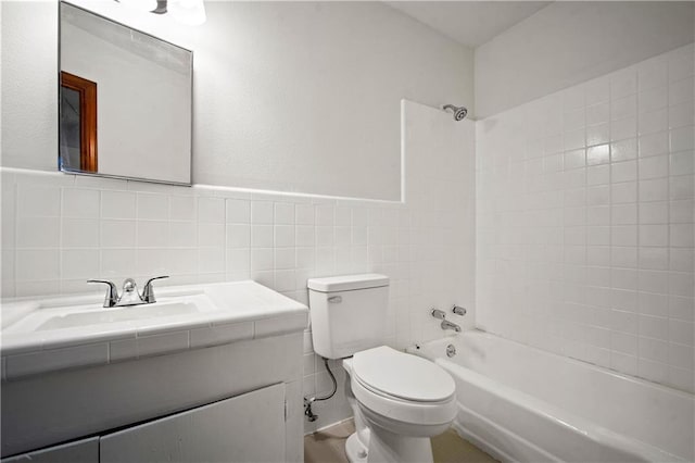 754 Pinemont Dr, Mobile, AL 36609 - full bathroom featuring toilet, shower / tub combination, tile walls, vanity, and a wainscoted wall