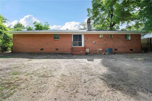 754 Pinemont Dr, Mobile, AL 36609 - rear view of house with crawl space, entry steps, a chimney, and cooling unit