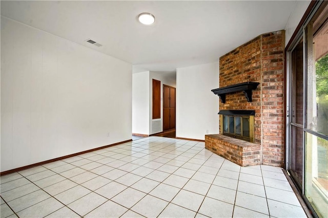 754 Pinemont Dr, Mobile, AL 36609 - unfurnished living room with a fireplace, baseboards, and light tile patterned floors