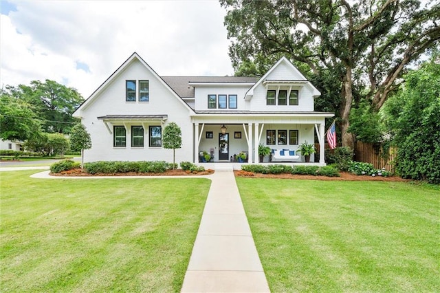 view of front of home featuring a front lawn and a porch