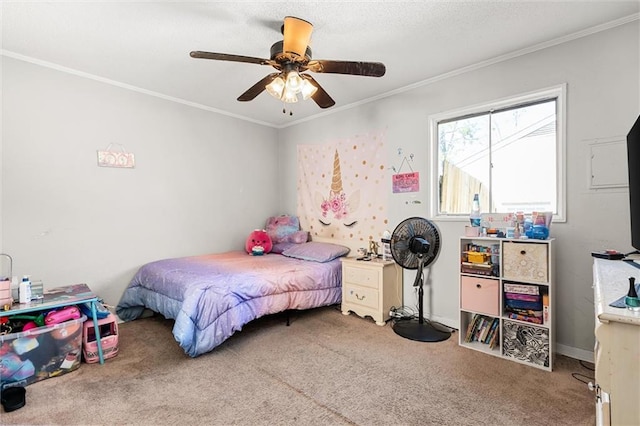 carpeted bedroom with crown molding, a ceiling fan, and baseboards