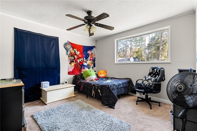 bedroom featuring ornamental molding, a textured ceiling, and carpet floors