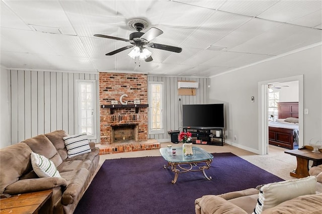 carpeted living room with a wall unit AC, a healthy amount of sunlight, baseboards, and ceiling fan