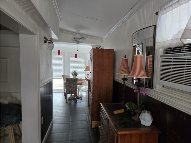 kitchen featuring a ceiling fan and crown molding