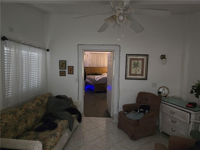 living area featuring a ceiling fan