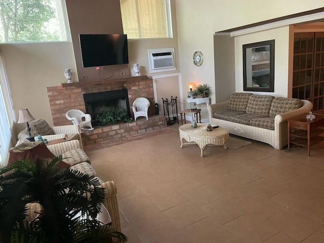 living area featuring a wall unit AC and a fireplace