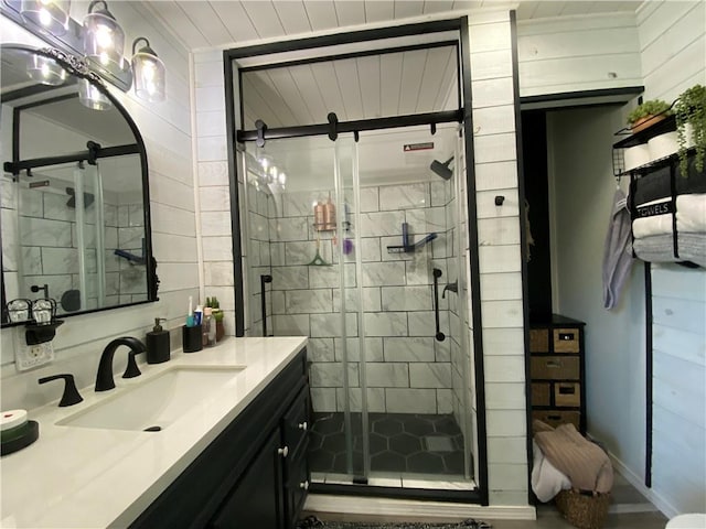 full bathroom featuring a shower stall and vanity