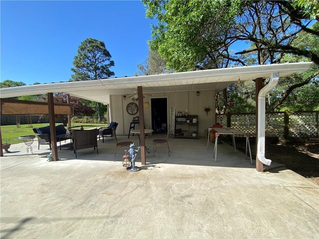 view of patio / terrace with an outdoor living space and fence