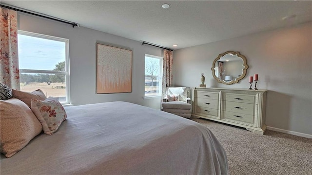 bedroom featuring carpet floors and baseboards