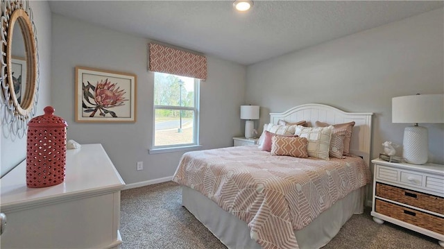 carpeted bedroom with baseboards