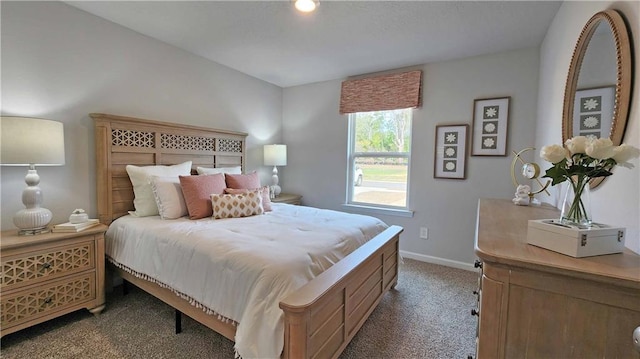 carpeted bedroom with baseboards