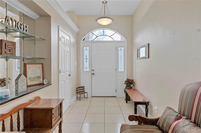 entrance foyer featuring light tile patterned floors and baseboards