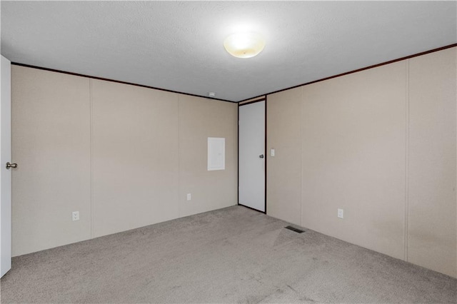 unfurnished room with visible vents and carpet