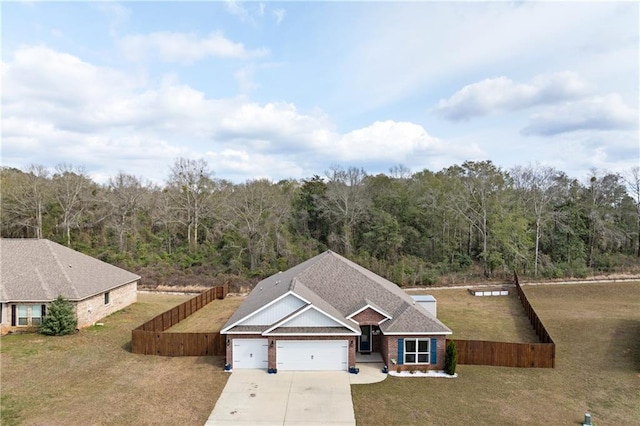 drone / aerial view with a wooded view