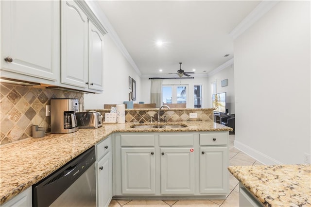 1449 Lagoon Dr W Unit B, Gulf Shores, AL 36542 - kitchen with a sink, stainless steel dishwasher, a peninsula, ornamental molding, and light tile patterned floors