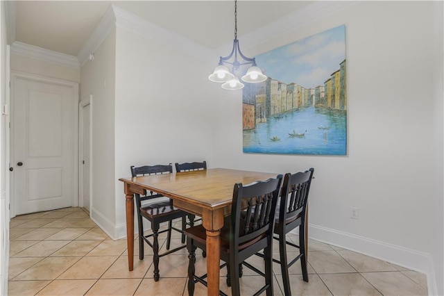1449 Lagoon Dr W Unit B, Gulf Shores, AL 36542 - dining space featuring light tile patterned floors, crown molding, a chandelier, and baseboards
