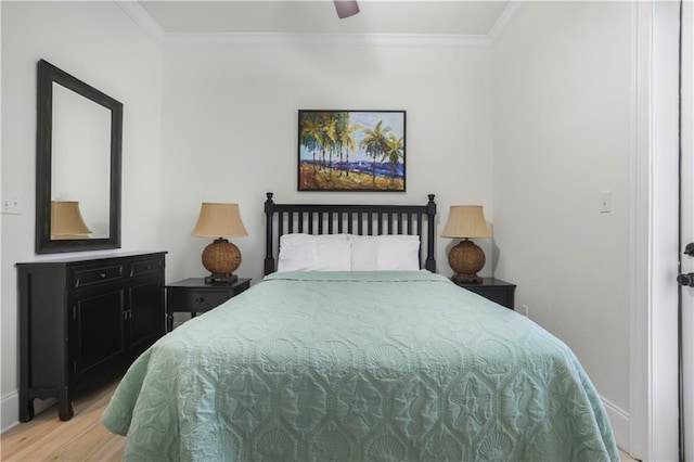 1449 Lagoon Dr W Unit B, Gulf Shores, AL 36542 - bedroom featuring light wood finished floors, ornamental molding, baseboards, and ceiling fan