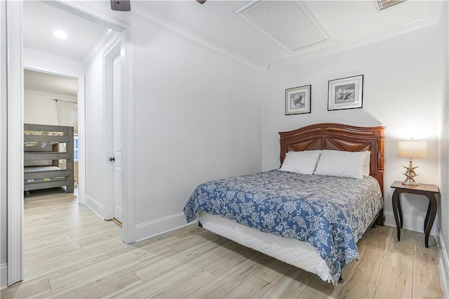 1449 Lagoon Dr W Unit B, Gulf Shores, AL 36542 - bedroom featuring attic access, light wood-style flooring, ornamental molding, and baseboards