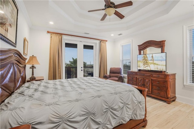 1449 Lagoon Dr W Unit B, Gulf Shores, AL 36542 - bedroom with a tray ceiling, access to outside, ornamental molding, french doors, and light wood-style flooring