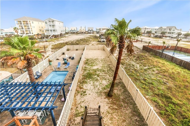 1449 Lagoon Dr W Unit B, Gulf Shores, AL 36542 - view of property's community featuring a fenced backyard and a residential view