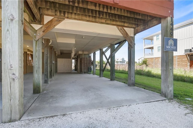 1449 Lagoon Dr W Unit B, Gulf Shores, AL 36542 - view of patio featuring a carport