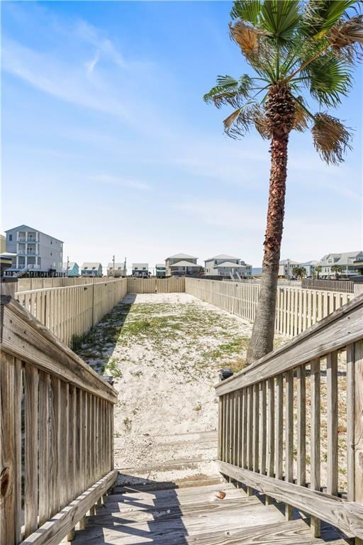 1449 Lagoon Dr W Unit B, Gulf Shores, AL 36542 - wooden deck featuring a fenced backyard