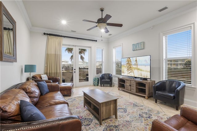 1449 Lagoon Dr W Unit B, Gulf Shores, AL 36542 - living room featuring light tile patterned floors, a ceiling fan, ornamental molding, french doors, and baseboards