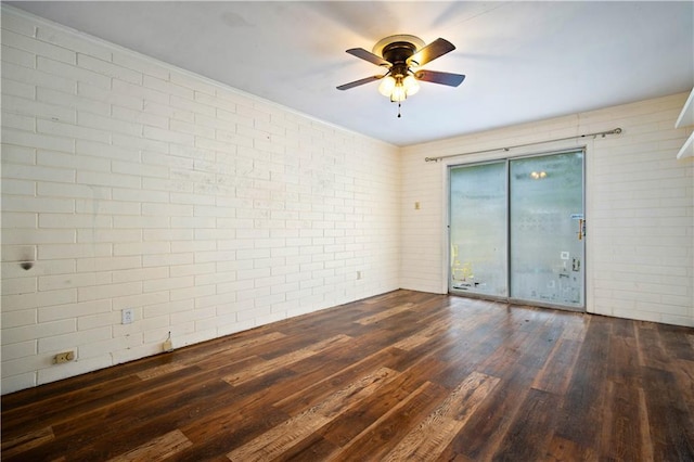 4359 Montclair Cir E, Mobile, AL 36693 - unfurnished room with ceiling fan, wood finished floors, and brick wall