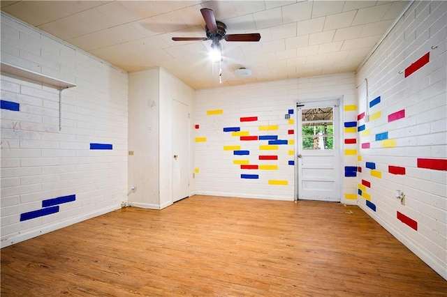 4359 Montclair Cir E, Mobile, AL 36693 - playroom featuring wood finished floors, a ceiling fan, baseboards, and brick wall
