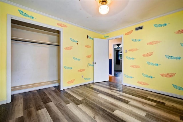 4359 Montclair Cir E, Mobile, AL 36693 - unfurnished bedroom featuring wood finished floors, ornamental molding, a closet, and baseboards