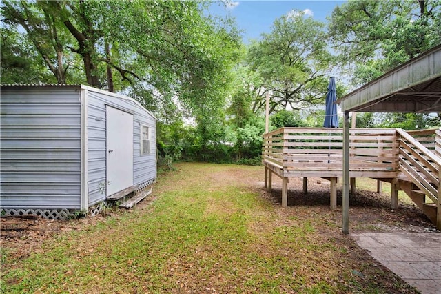 4359 Montclair Cir E, Mobile, AL 36693 - view of green lawn featuring a storage shed, an outbuilding, and a wooden deck