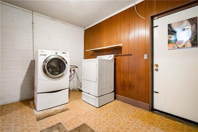 4359 Montclair Cir E, Mobile, AL 36693 - washroom featuring independent washer and dryer, wooden walls, crown molding, and light floors