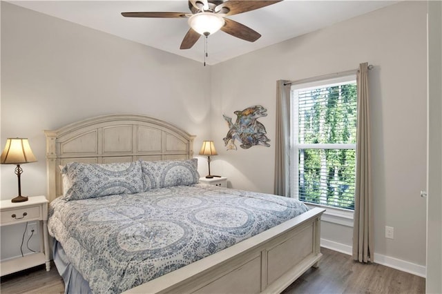 bedroom featuring ceiling fan and wood-type flooring