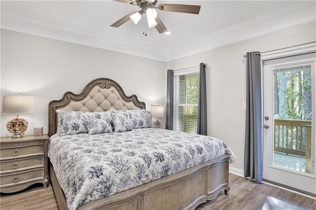 bedroom with access to exterior, ceiling fan, light hardwood / wood-style flooring, and multiple windows