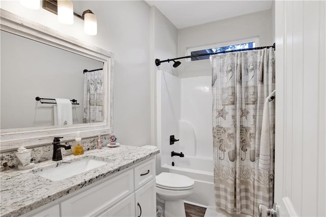 full bathroom with shower / tub combo with curtain, vanity, hardwood / wood-style floors, and toilet