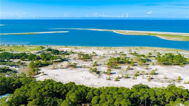 aerial view featuring a view of the beach and a water view