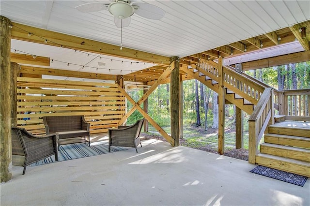 view of patio with an outdoor living space and ceiling fan