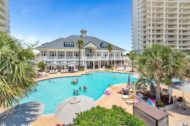 527 Beach Club Trl Unit D1103, Gulf Shores, AL 36542 - community pool with a patio area