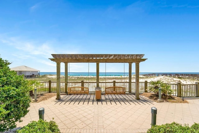 527 Beach Club Trl Unit D1103, Gulf Shores, AL 36542 - view of patio featuring a pergola and view of water and beach