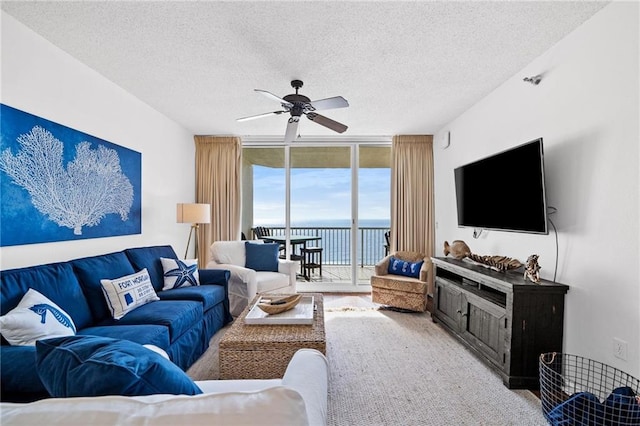 527 Beach Club Trl Unit D1103, Gulf Shores, AL 36542 - living area featuring expansive windows, a textured ceiling, and ceiling fan
