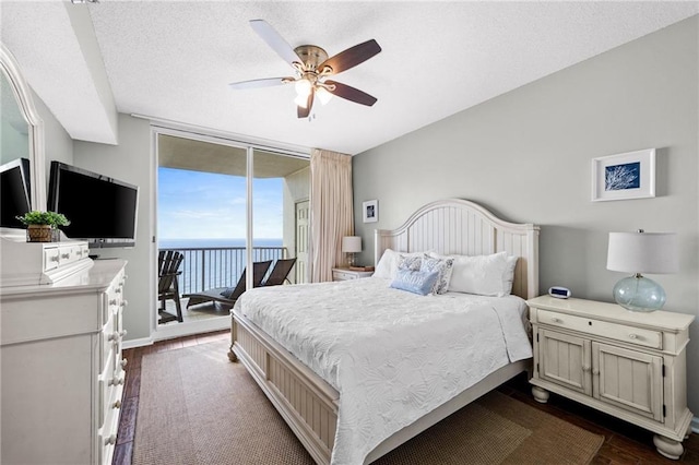 527 Beach Club Trl Unit D1103, Gulf Shores, AL 36542 - bedroom with access to exterior, dark wood-style floors, expansive windows, and a ceiling fan