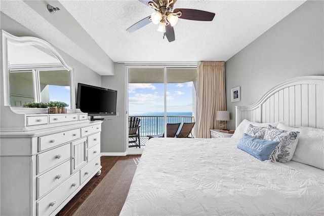 527 Beach Club Trl Unit D1103, Gulf Shores, AL 36542 - bedroom with access to exterior, dark wood-style flooring, a textured ceiling, floor to ceiling windows, and a ceiling fan