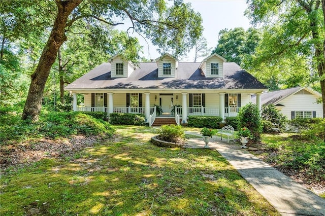 cape cod-style house featuring a porch