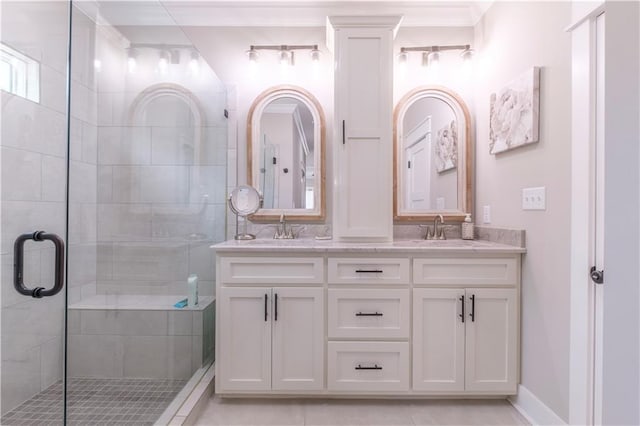 bathroom featuring vanity, ornamental molding, tile patterned floors, and a shower with door