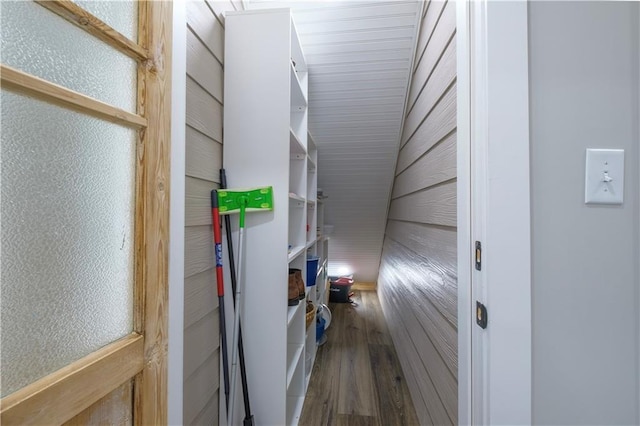 hallway with hardwood / wood-style floors