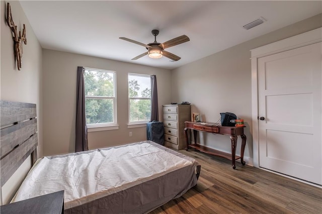 bedroom featuring hardwood / wood-style floors and ceiling fan