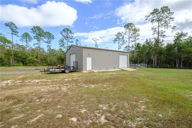 exterior space featuring a lawn and a garage