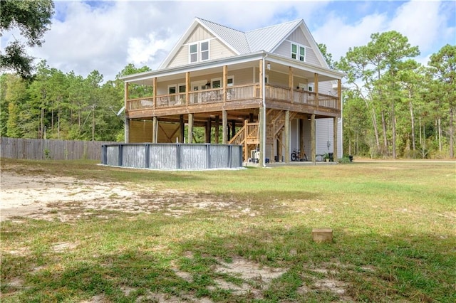 back of property featuring a lawn