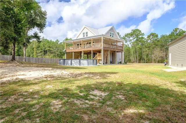 back of house with a yard