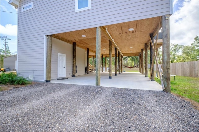 exterior space with a carport